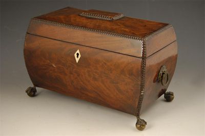 Appraisal: An early Victorian mahogany tea chest of swollen sarcophagus form