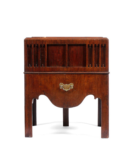 Appraisal: A GEORGE III MAHOGANY COMMODE with dished top blind fret