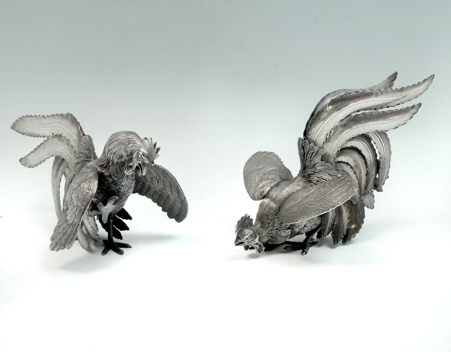 Appraisal: PAIR CONTINENTAL SILVER-GILT COCKEREL TABLE ORNAMENTS Fighting Roosters having a