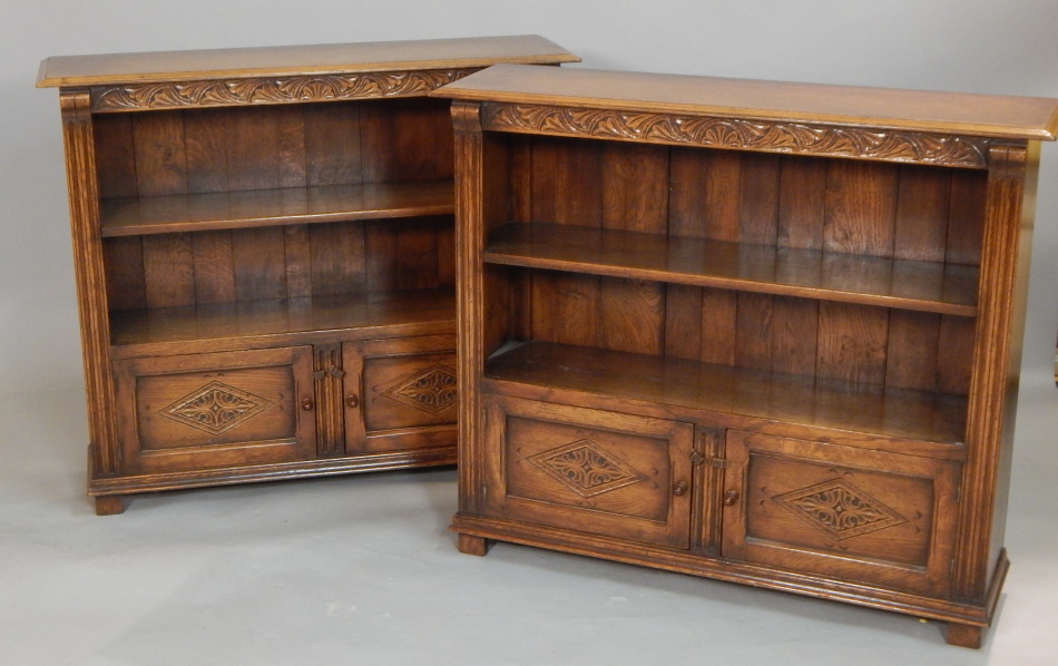 Appraisal: A pair of Titchmarsh and Goodwin carved oak open bookcases