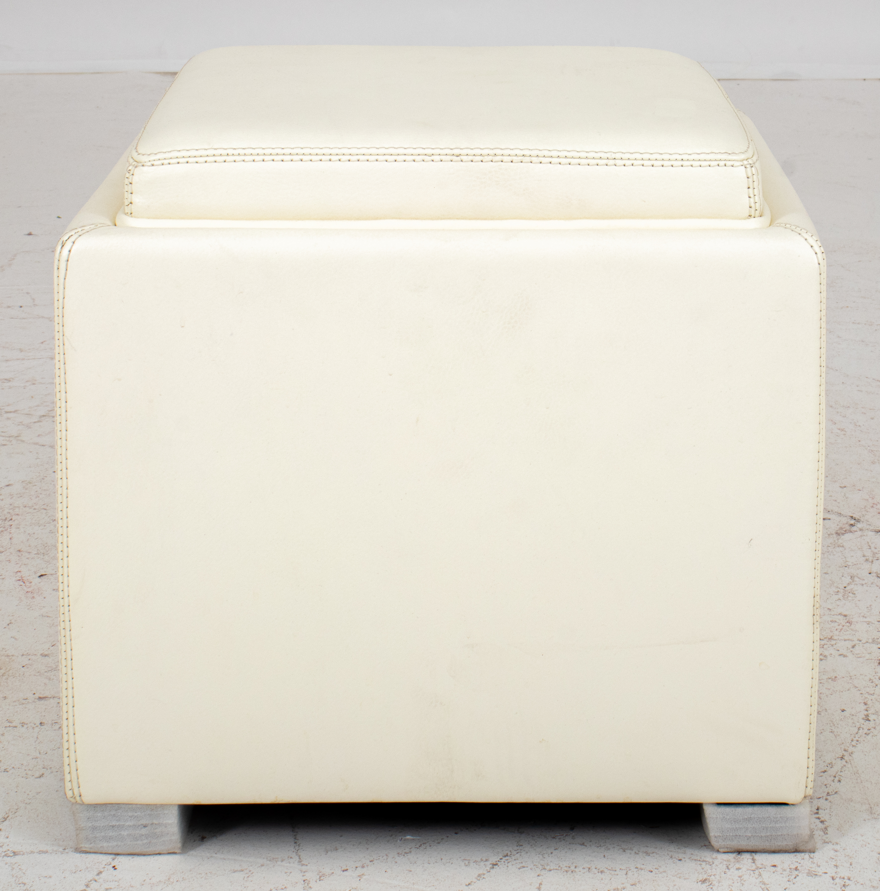 Appraisal: WHITE LEATHER STORAGE CUBE OTTOMAN White leather storage cube ottoman