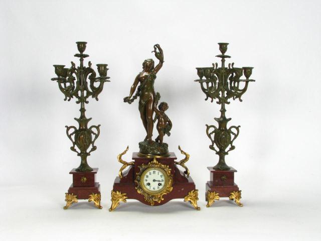 Appraisal: Three Piece French clock with garniture marble and bronzed cast