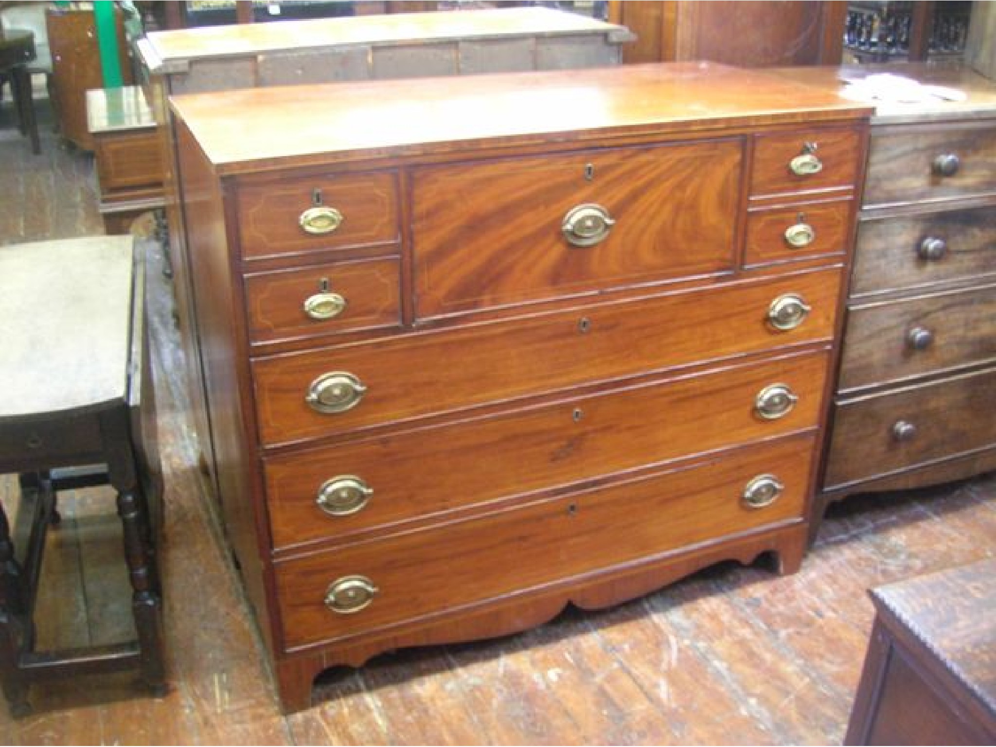 Appraisal: An early th century mahogany secretaire chest the central secretaire