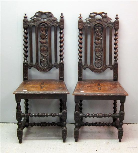 Appraisal: Pair of th century carved oak dining chairs with panel