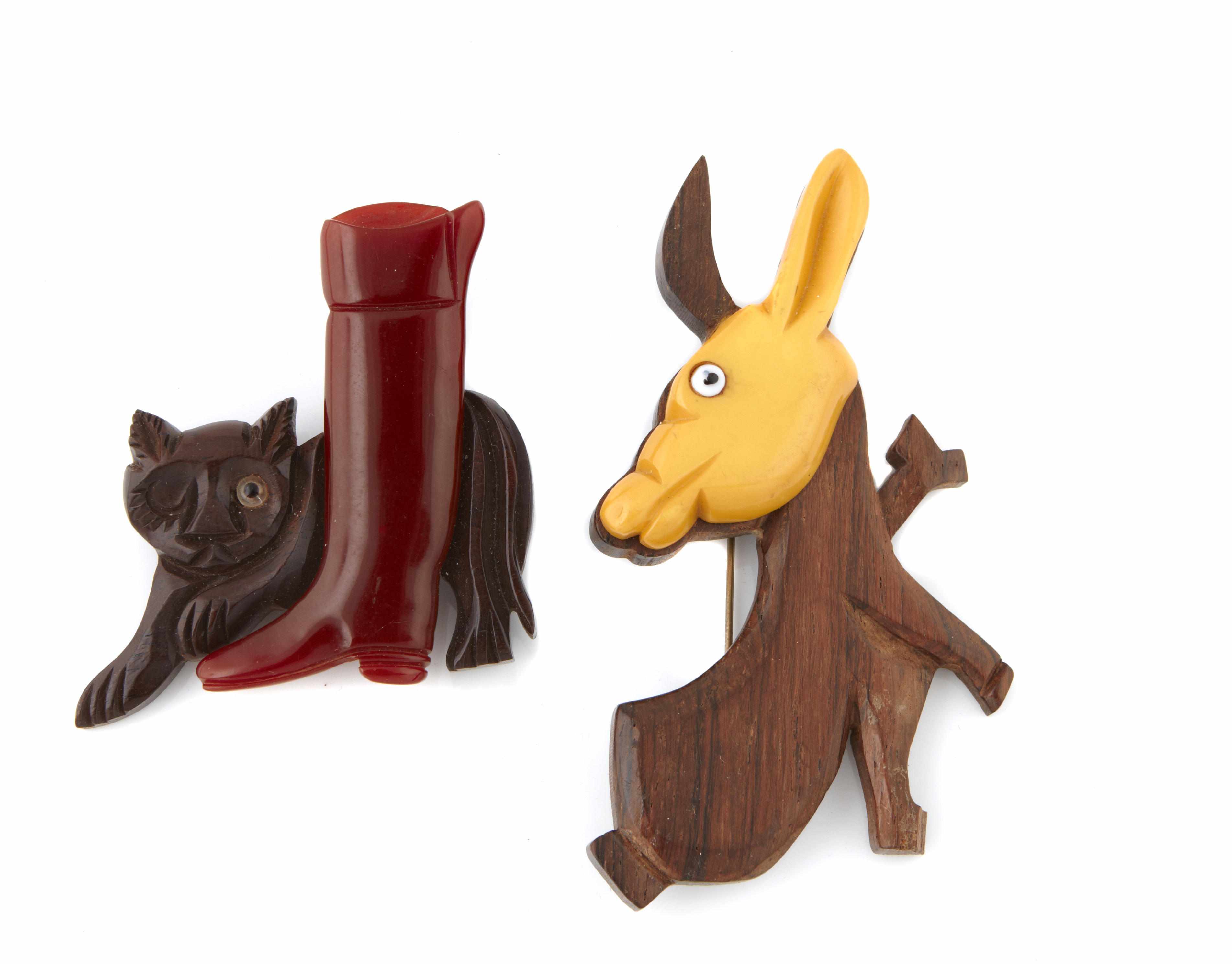 Appraisal: Two Bakelite and wood animal brooches cat and donkey dimensions