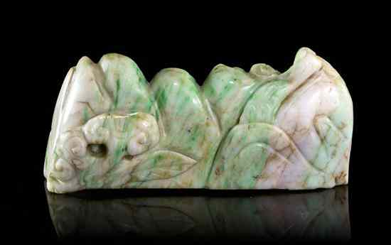 Appraisal: A Carved Jadeite Brush Rest of green and white colored