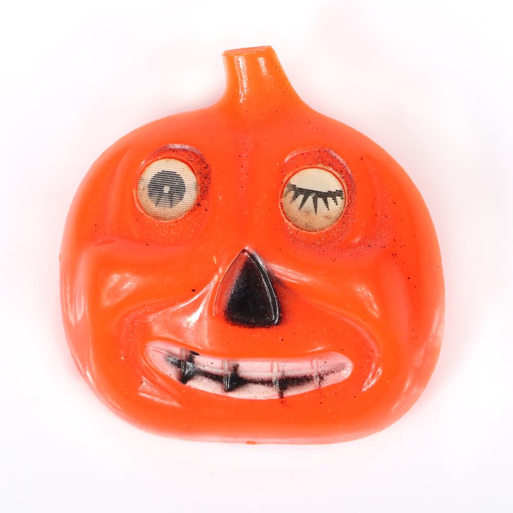 Appraisal: VINTAGE CELLULOID HALLOWEEN LENTICULAR WINKING AND SMILING JACK-O-LANTERN PUMPKIN PIN