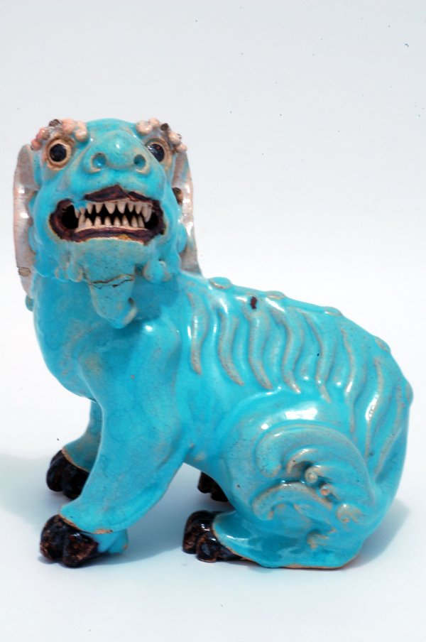 Appraisal: Seated foo dog with turquoise glaze open mouth large curved