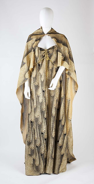 Appraisal: A full length gold and black lame dress and cloak