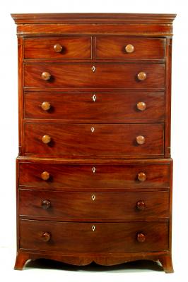 Appraisal: A GEORGE III MAHOGANY CHEST ON CHEST of bowed form