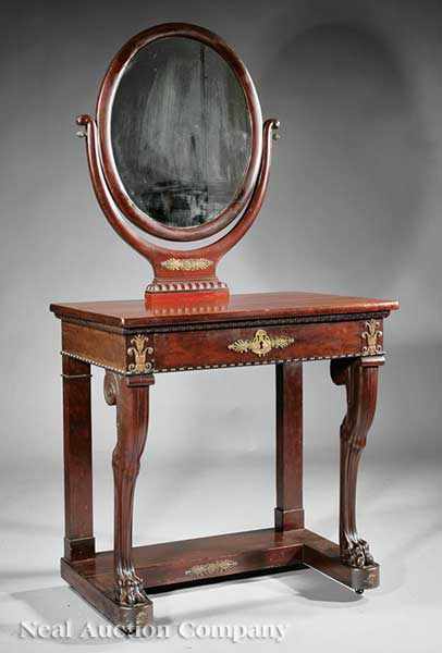 Appraisal: An Antique Empire-Style Bronze-Mounted Carved Mahogany Dressing Table having an