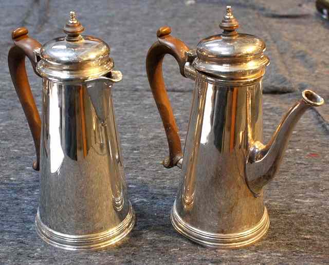 Appraisal: A CONICAL SHAPED SILVER COFFEE POT with domed hinged lid