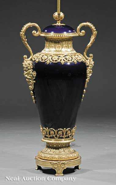 Appraisal: A Monumental Napoleon III Cobalt Porcelain and Gilt Bronze-Mounted Table