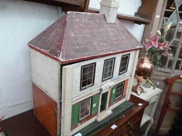 Appraisal: AN OLD DOLLS HOUSE in the form of a red