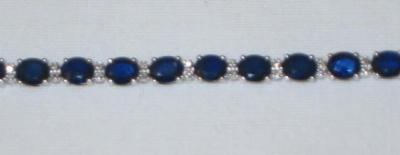 Appraisal: A SAPPHIRE AND DIAMOND BRACELET comprising oval cut sapphires claw