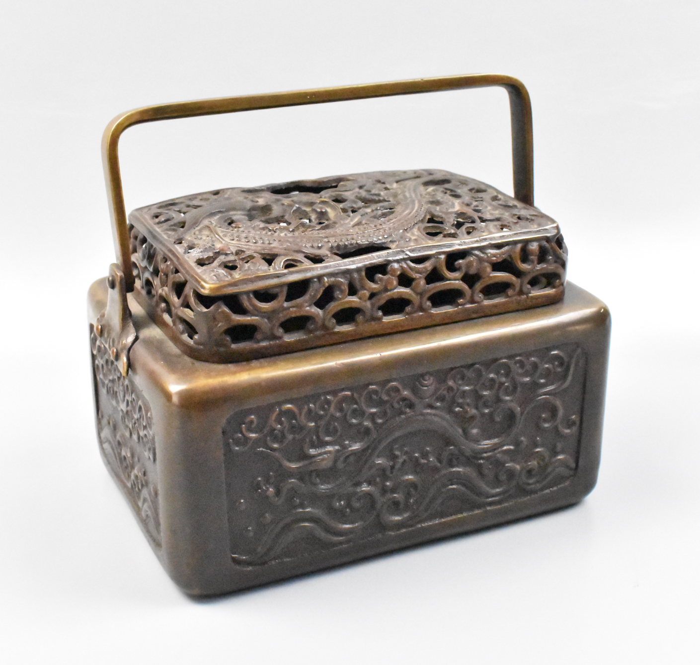 Appraisal: A large Chinese bronze hand warmer shaped like a basket