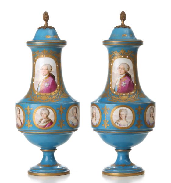 Appraisal: A PAIR HAND PAINTED FRENCH PORCELAIN COVERED URNSThe porcelain pair