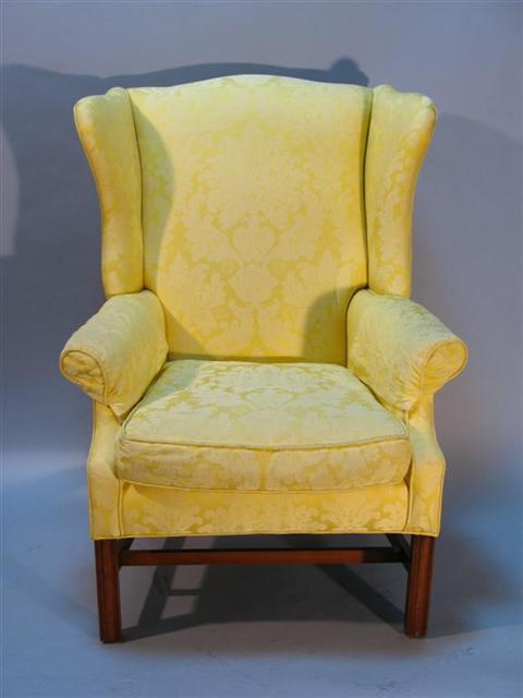 Appraisal: CHIPPENDALE STYLE MAHOGANY WING CHAIR Modern yellow damask upholstery -