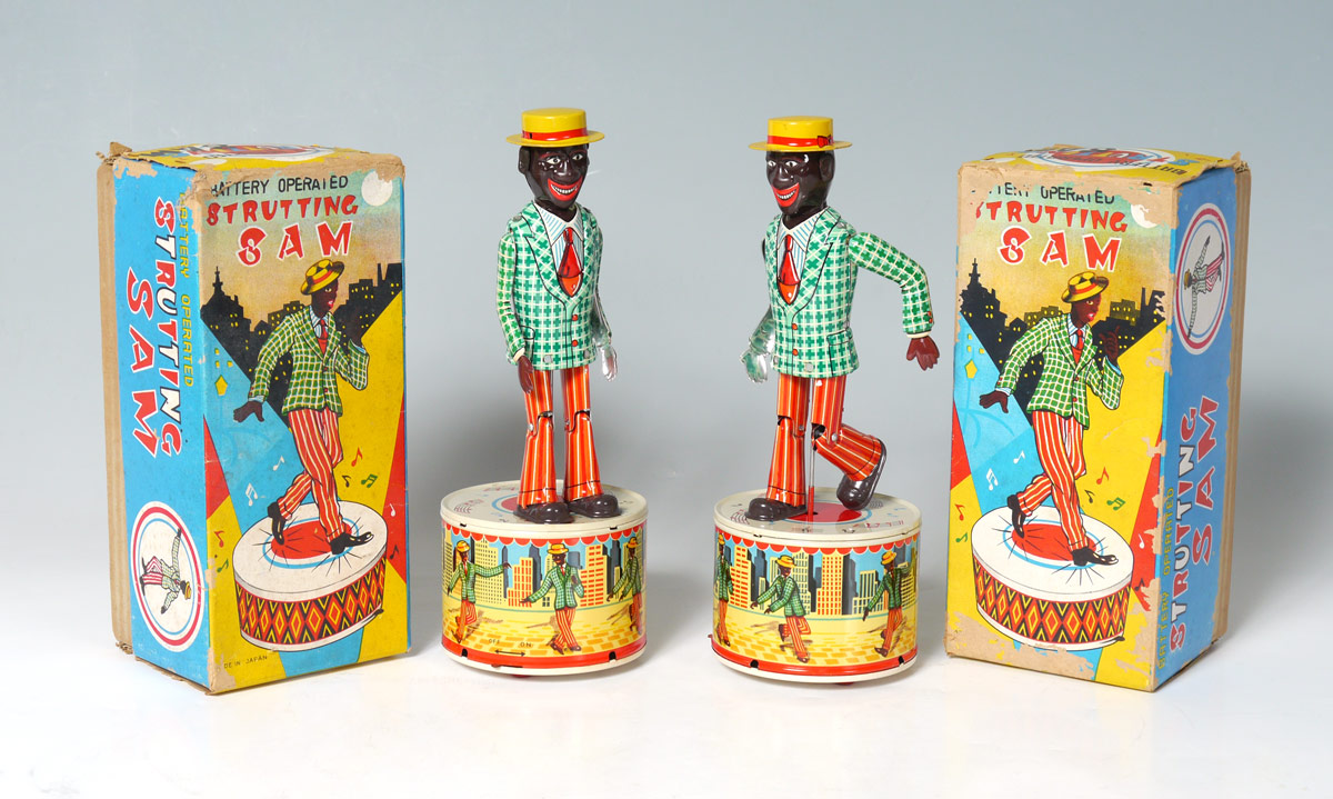 Appraisal: BATTERY OPERATED STRUTTING SAM TOYS WITH BOXES tin lithograph ''Strutting