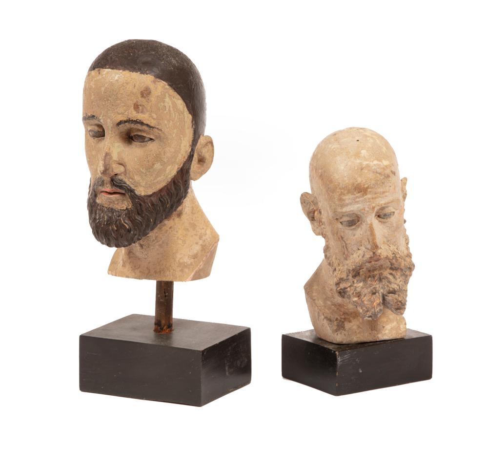 Appraisal: Two Continental Carved and Polychromed Heads of Saints with glass