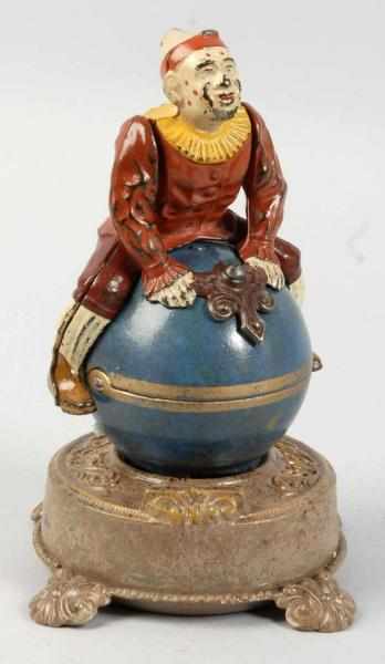 Appraisal: Cast Iron Clown on Globe Mechanical Bank Description Manufactured by