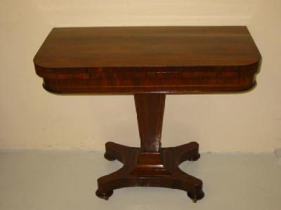 Appraisal: A ROSEWOOD FOLDING CARD TABLE early th century of rounded