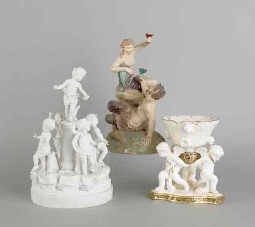 Appraisal: Three porcelain figural groups ca to include a cherub centerpiece