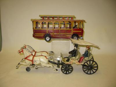 Appraisal: A painted cast iron model of a horse drawn Surrey