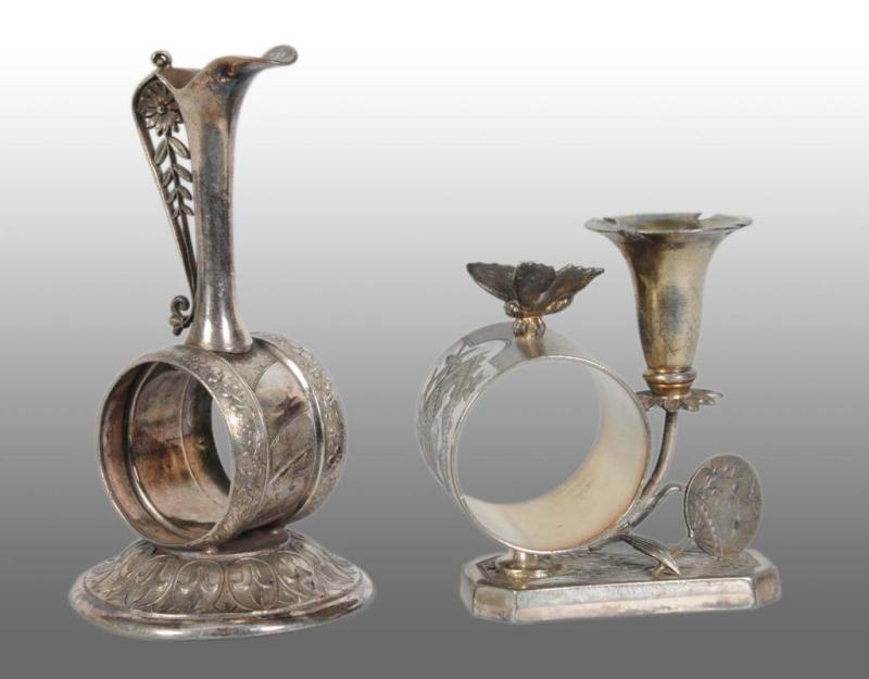 Appraisal: Lot of Figural Napkin Rings Description Includes a pitcher-shaped bud