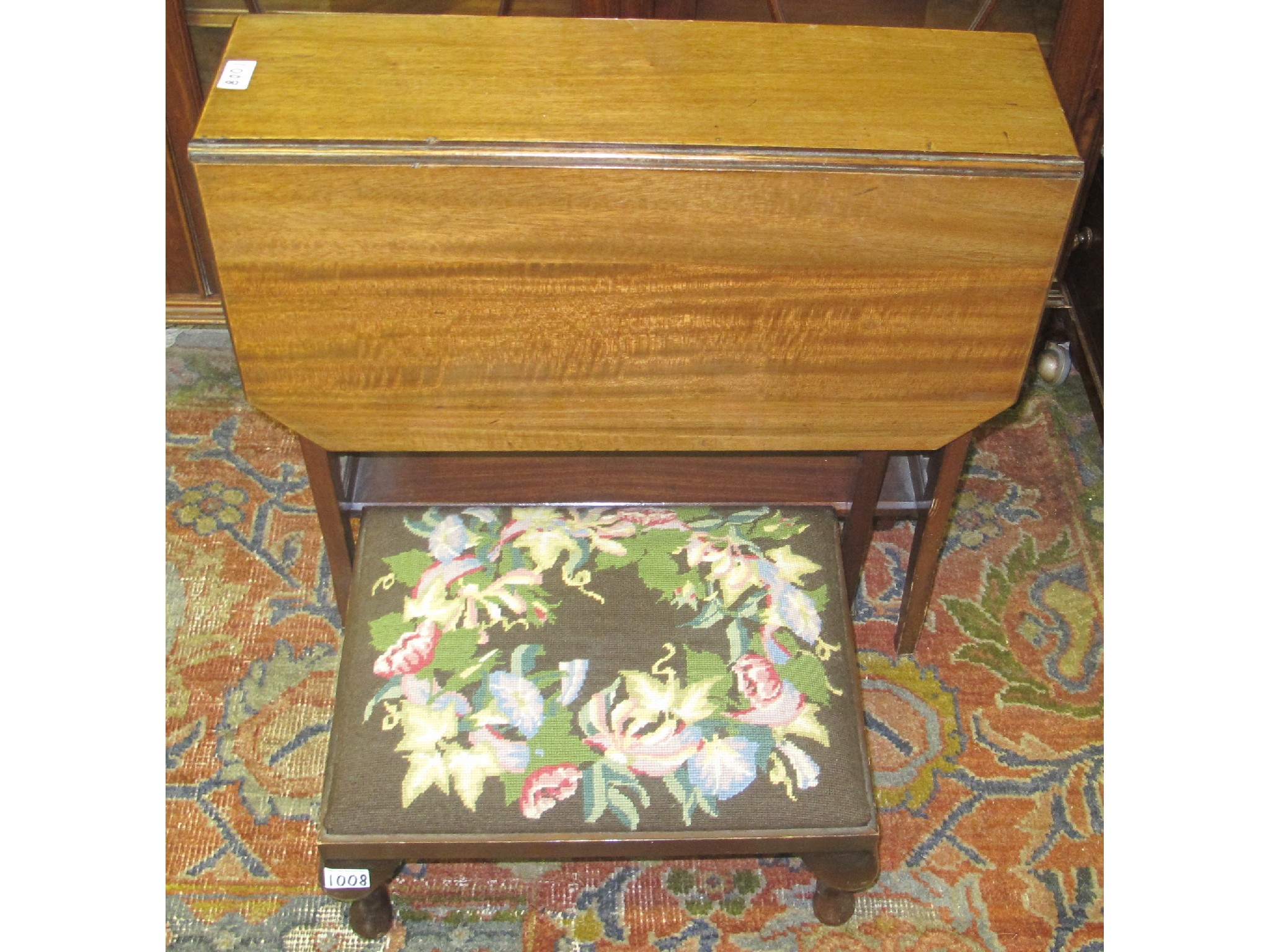 Appraisal: A mahogany Sutherland table and upholstered footstool