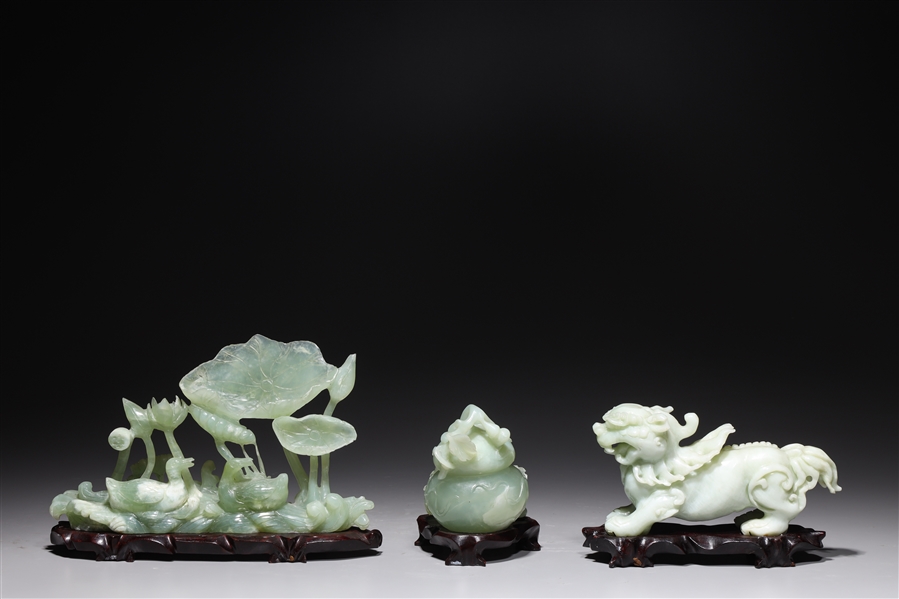 Appraisal: Group of three Chinese hardstone carvings including gourd form lion