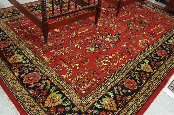 Appraisal: HAND KNOTTED ORIENTAL CARPET Indo-Sarouk overall floral design on red