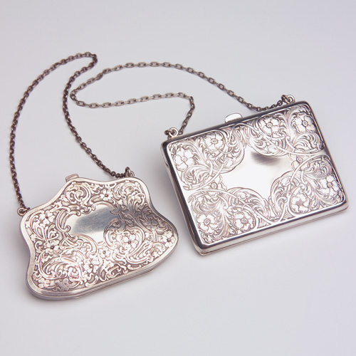 Appraisal: ART NOUVEAU Two sterling purses with floral scroll decoration by