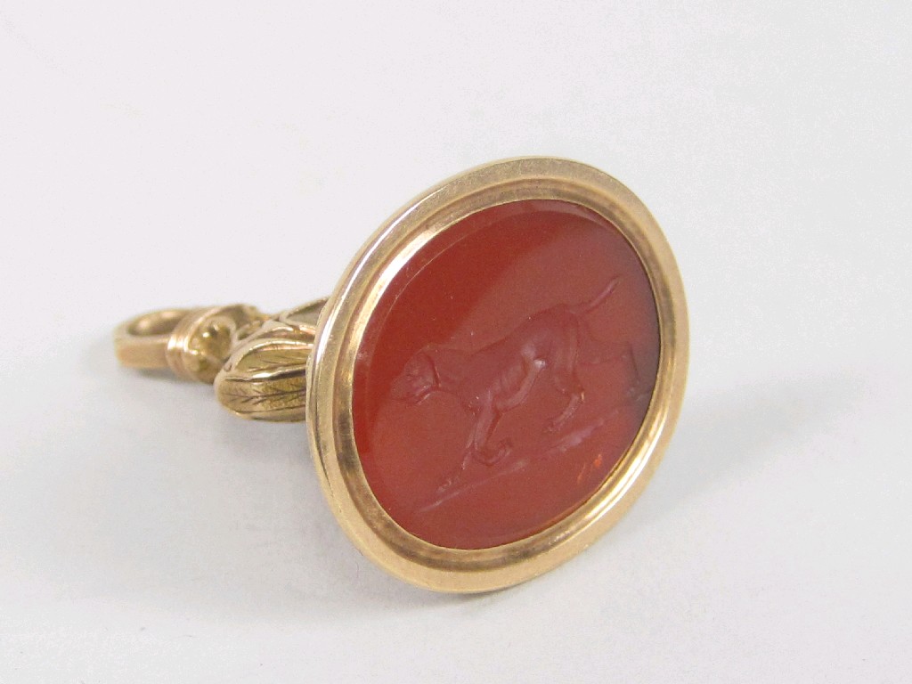 Appraisal: A gold Seal set cornelian intaglio carved figure of a