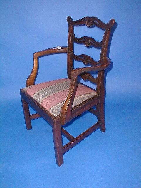 Appraisal: A George III style child's mahogany open armchair with pierced