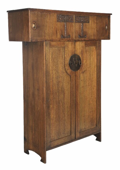 Appraisal: A Liberty Co oak hall cupboard with two upper sliding