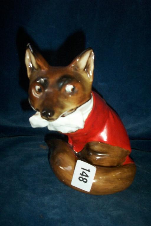 Appraisal: A Royal Doulton figure of a seated fox in red