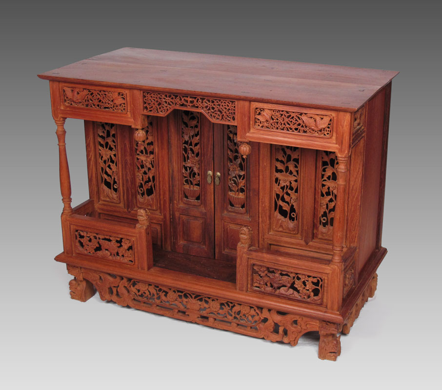 Appraisal: PROFUSELY CARVED TEAK ALTAR TABLE Teak top with carved and