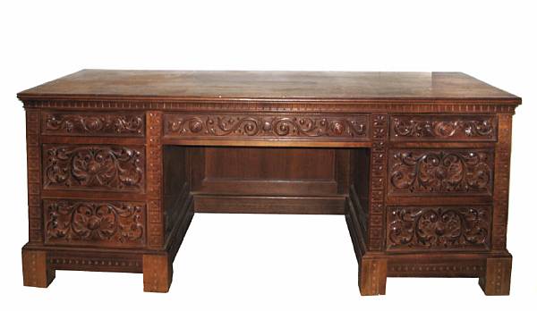 Appraisal: A Renaissance Revival carved walnut kneehole desk height in width