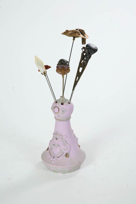 Appraisal: HAT PIN HOLDERS HAT PINS Bisque figural hat pin holder