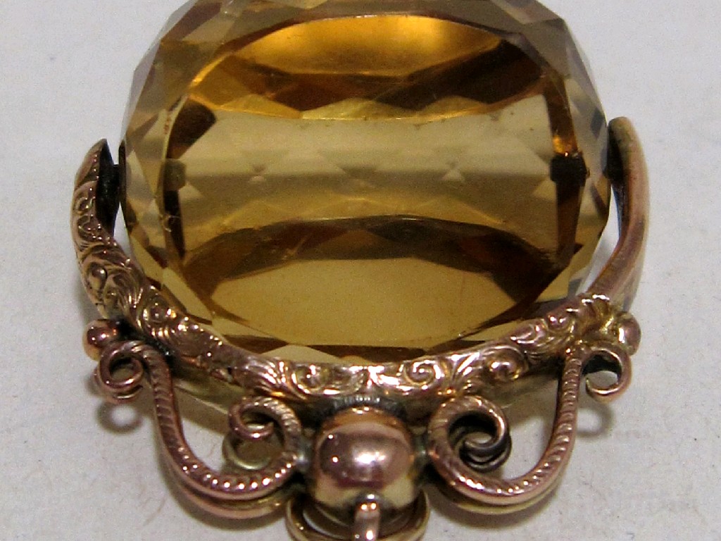 Appraisal: Victorian citrine revolving fob with unmarked gold mount