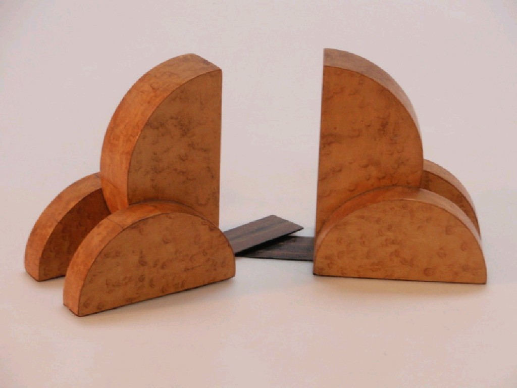 Appraisal: A pair of Art Deco birds eye maple bookends marked