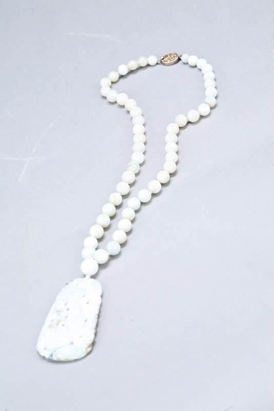 Appraisal: NECKLACE China th century lavender jade Beaded necklace with carved