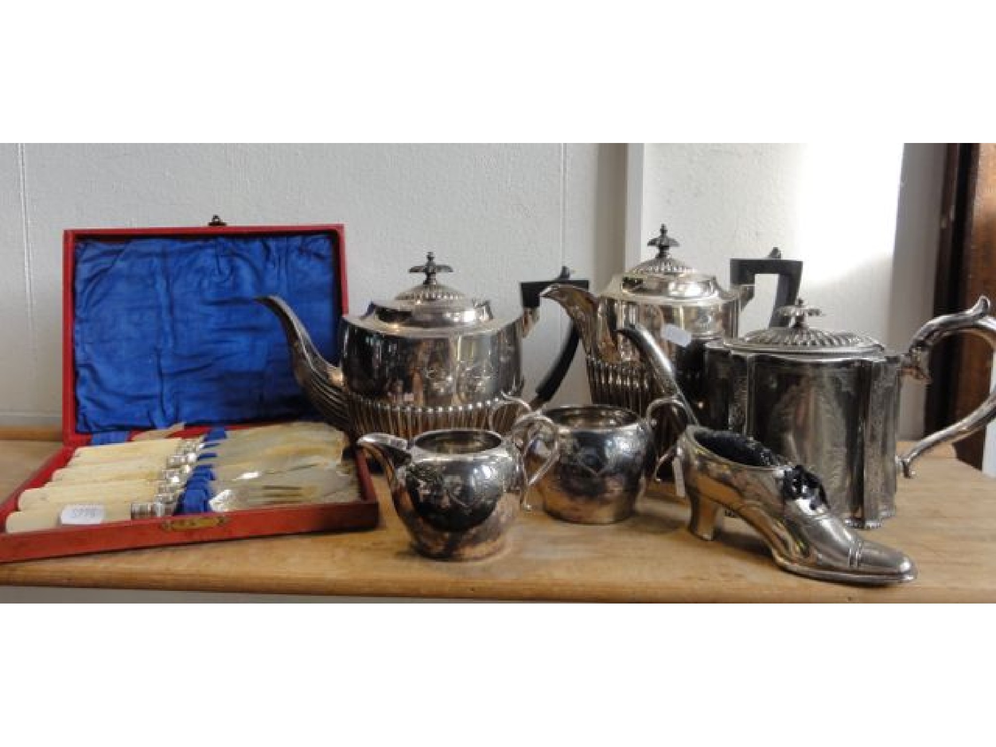 Appraisal: A collection of plated wares including a Walker Hall teapot