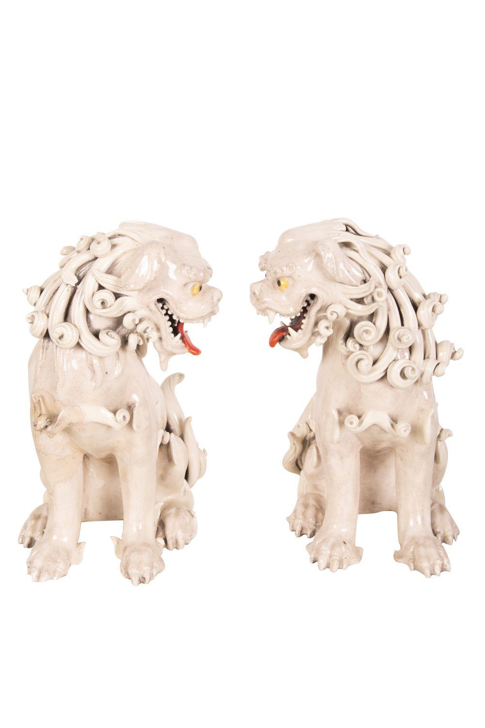 Appraisal: PAIR OF JAPANESE BLANC DE CHINE PORCELAIN FOO DOGSCondition with