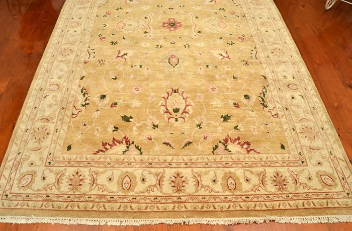 Appraisal: WOOLLEN FLOOR RUG FLORAL PATTERN ON BEIGE GROUND X