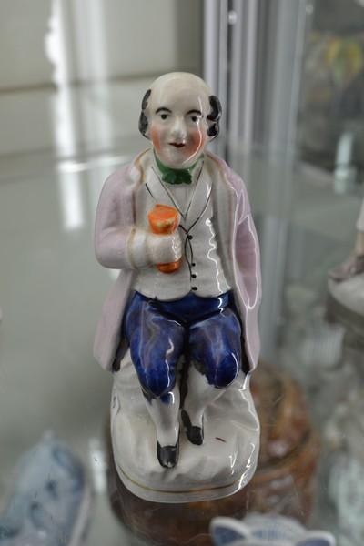 Appraisal: A TH CENTURY STAFFORDSHIRE POTTERY FIGURINE TAVERN CHARACTER