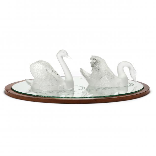 Appraisal: LALIQUE PAIR OF LARGE CRYSTAL SWAN SCULPTURES WITH MIRROR France