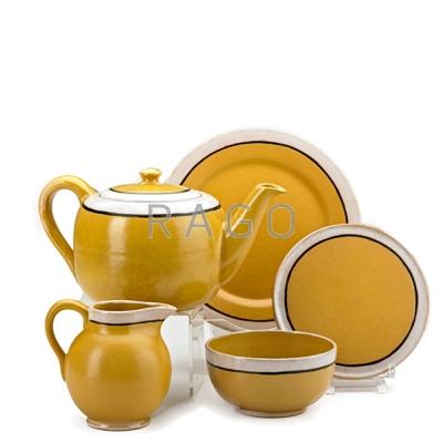 Appraisal: SATURDAY EVENING GIRLS Tea set decorated in cuerda seca one