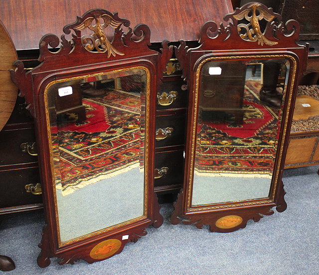 Appraisal: A PAIR OF GEORGIAN STYLE FRET FRAMED WALL MIRRORS each